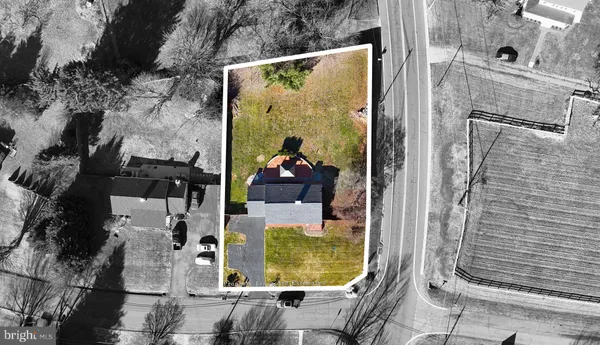 an aerial view of a highlighted house