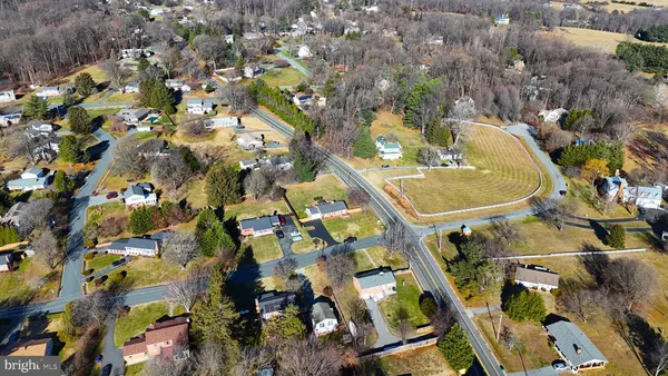 an aerial view of a house with outdoor space