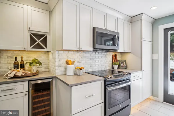 a kitchen with a stove and a microwave