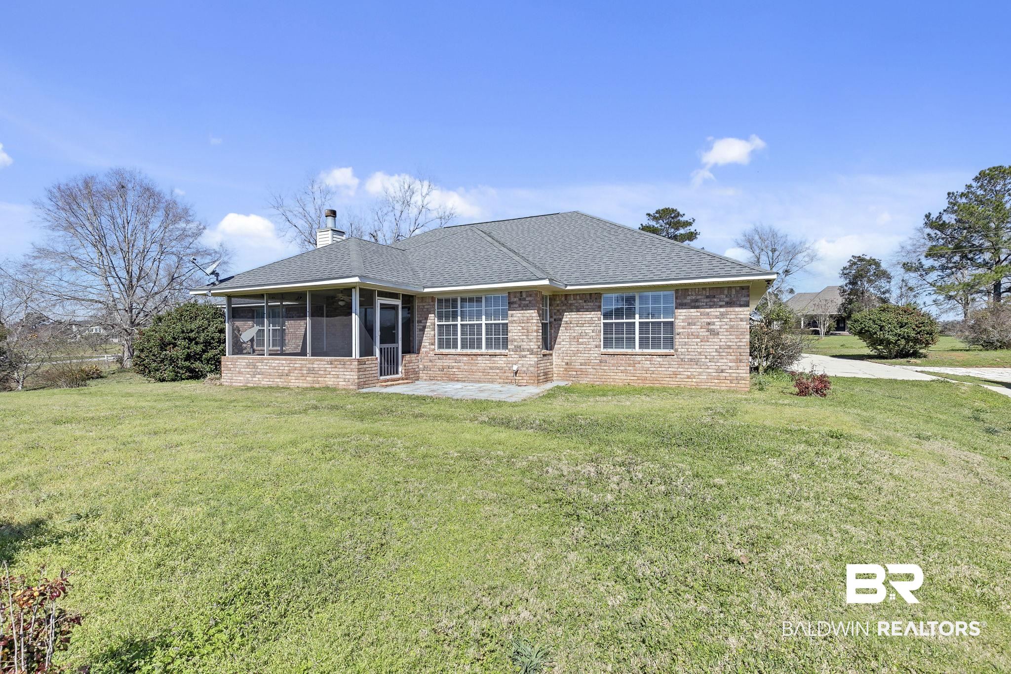 10238 Grove Drive Fairhope, AL 36532 - Photo 31 of 39 Ranch-style home with brick siding, a chimney, and a sunroom