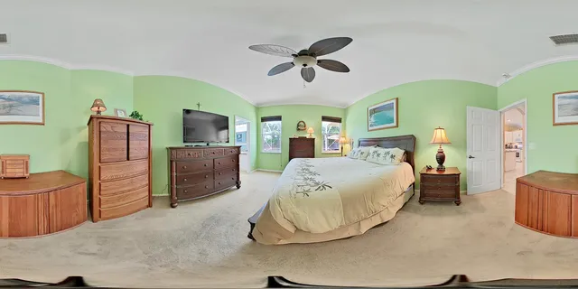 a bedroom with a bed and a dresser in it