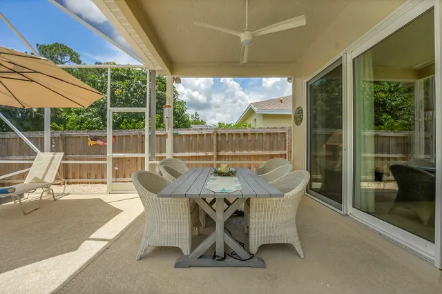 a balcony with couch and chairs