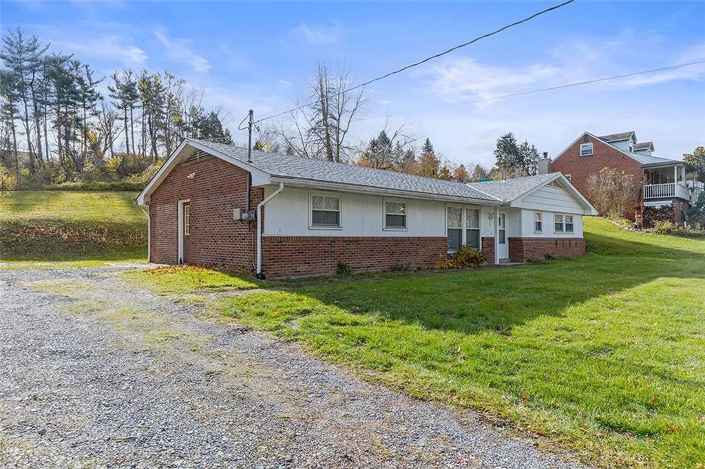 93 Stonesipher Road Oakdale, PA 15071 - Photo 3 of 36 a view of a house with a yard