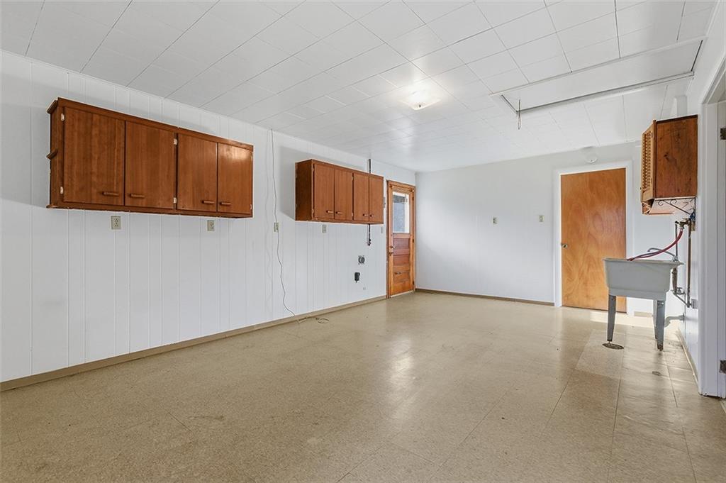 93 Stonesipher Road Oakdale, PA 15071 - Photo 31 of 36 a view of an empty room with wooden floor and a cabinet