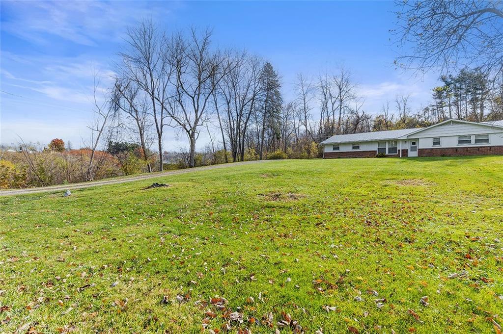 93 Stonesipher Road Oakdale, PA 15071 - Photo 4 of 36 a backyard of a house with lots of green space and mountain view