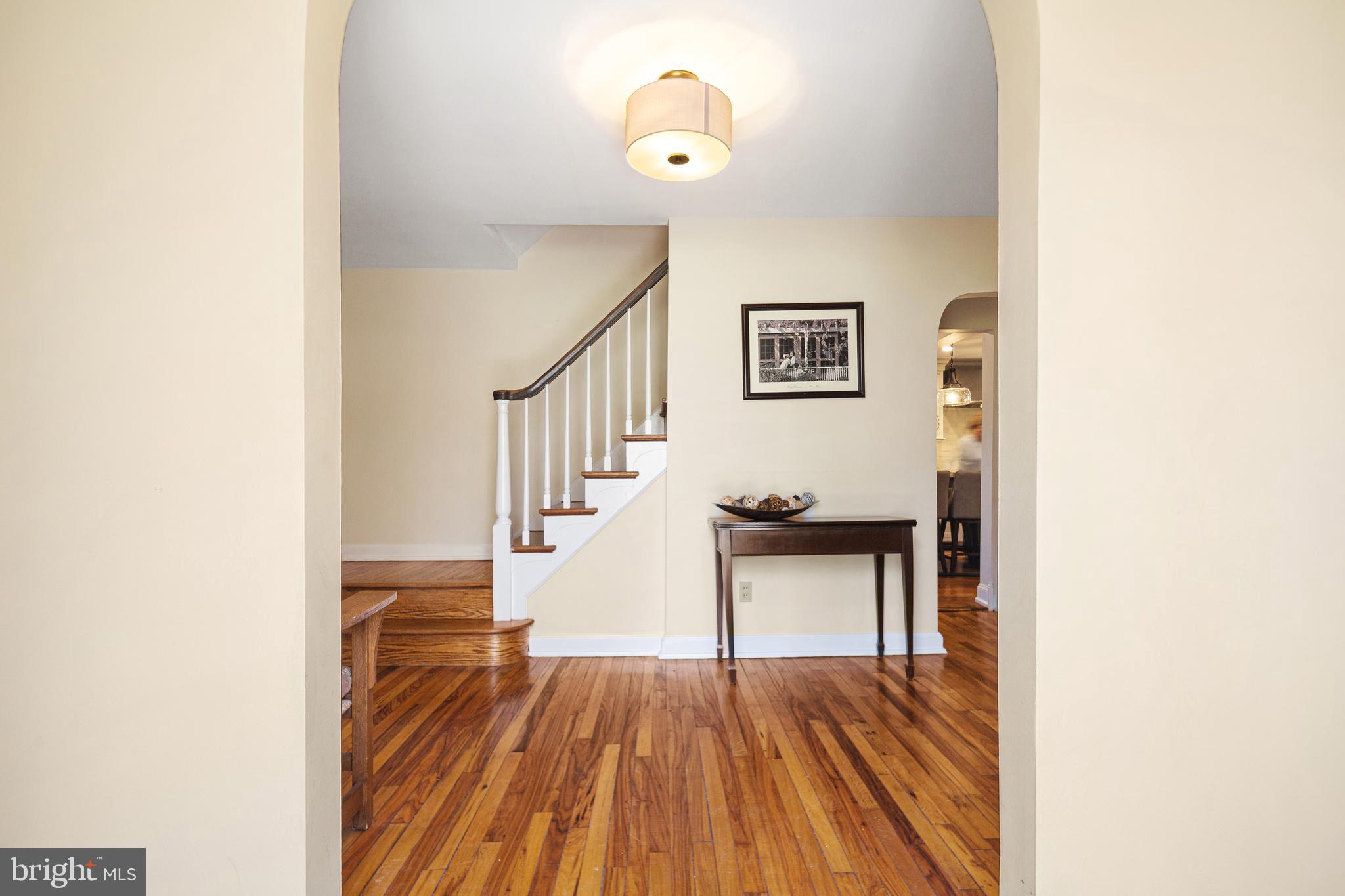 3 Briar Road Wayne, PA 19087 - Photo 2 of 48 a view of a hallway with wooden floor and staircase