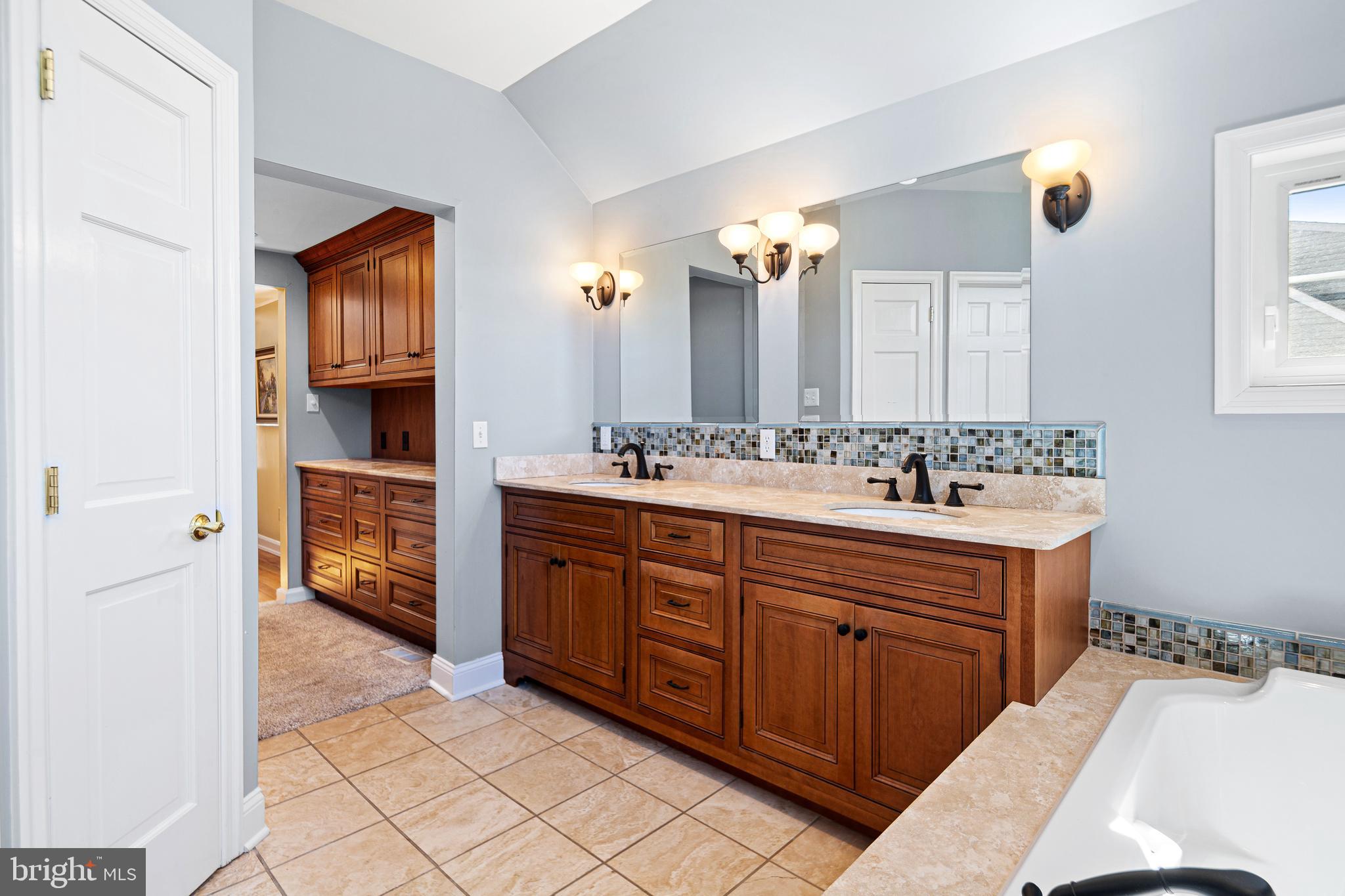 3 Briar Road Wayne, PA 19087 - Photo 22 of 48 a spacious bathroom with a double vanity sink double and a mirror