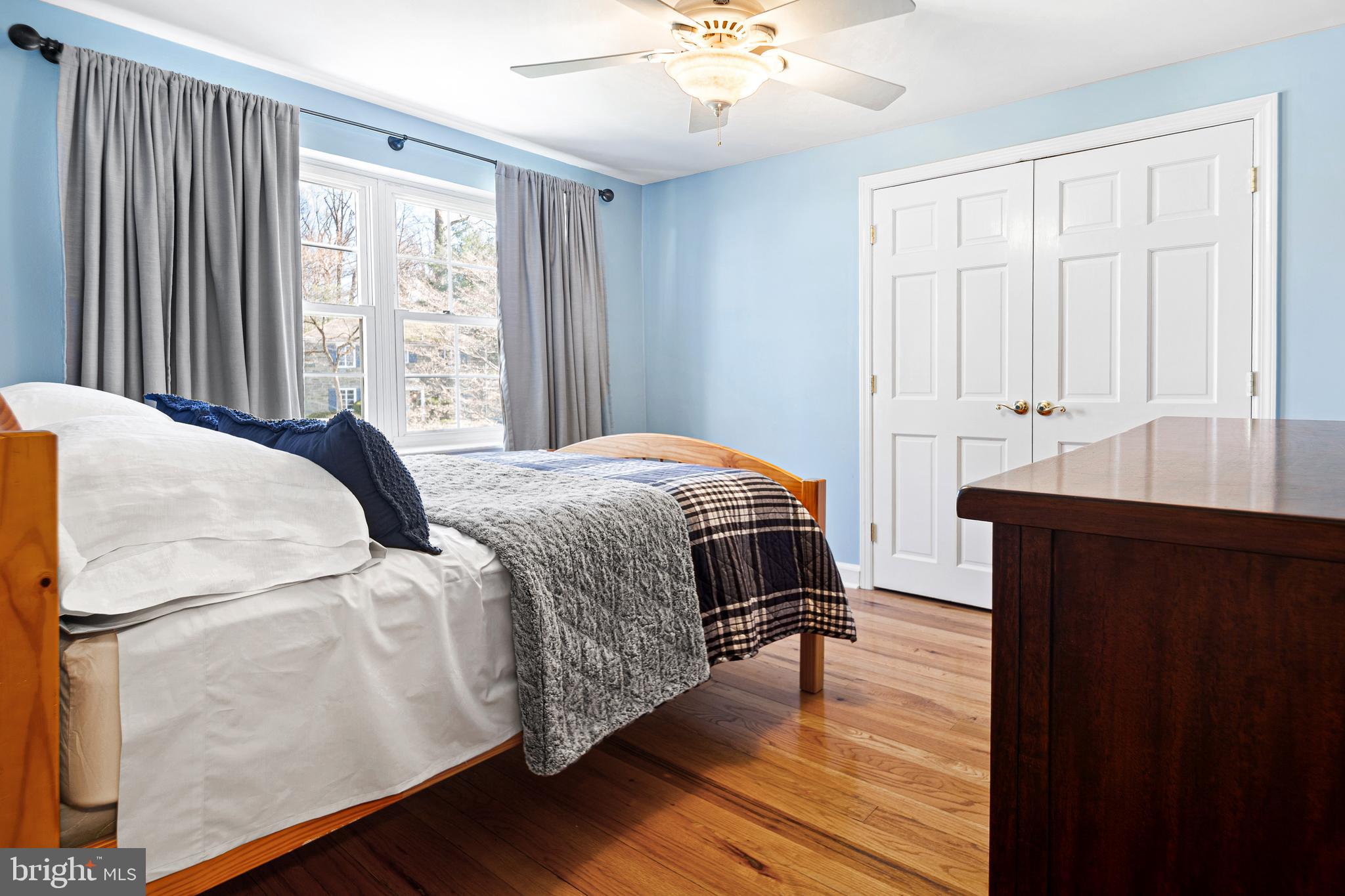 3 Briar Road Wayne, PA 19087 - Photo 24 of 48 a bedroom with a bed and wooden floor