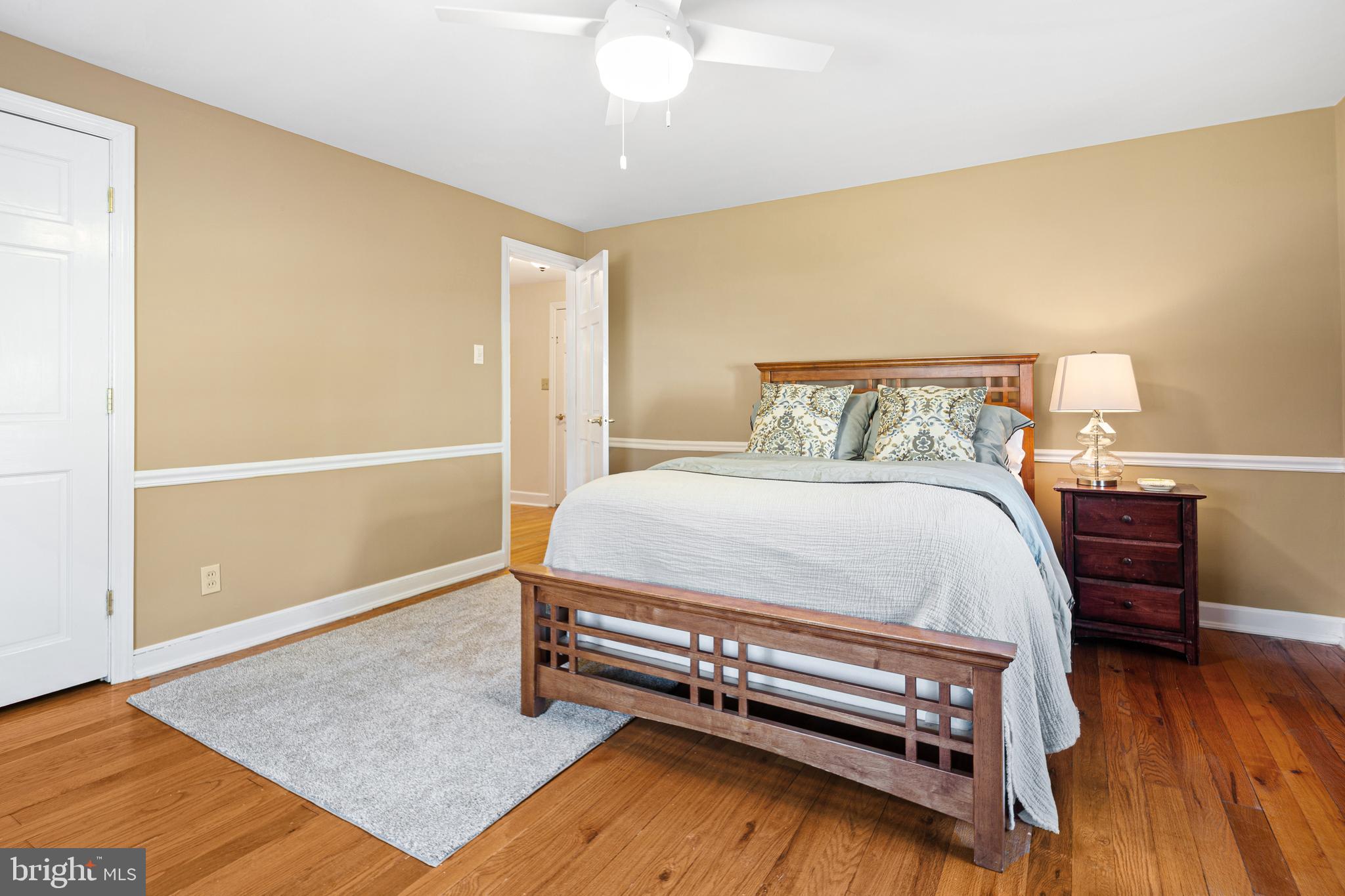 3 Briar Road Wayne, PA 19087 - Photo 27 of 48 a bedroom with a bed and wooden floor