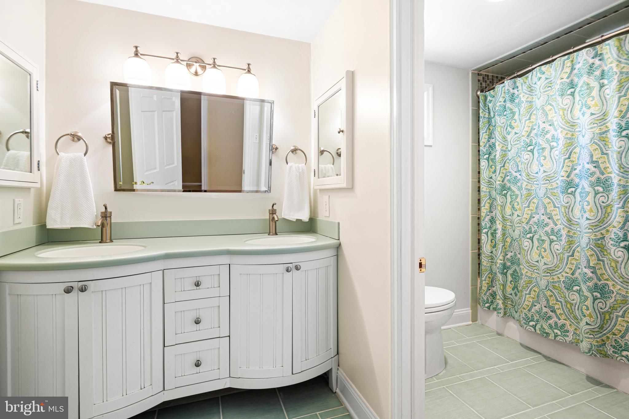 3 Briar Road Wayne, PA 19087 - Photo 35 of 48 a spacious bathroom with double vanity and a mirror