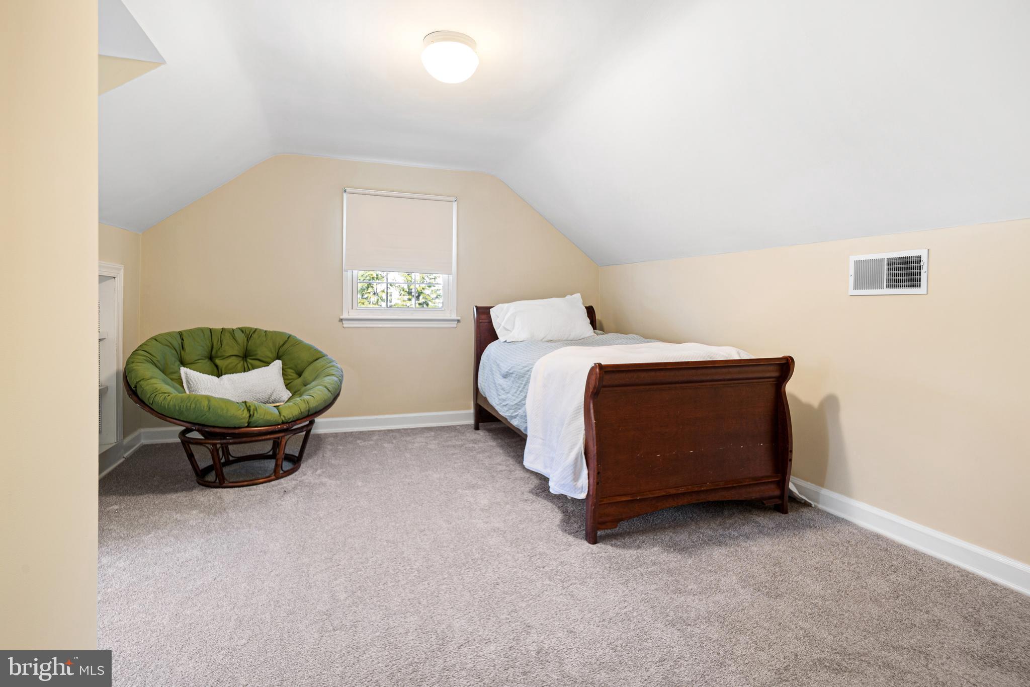 3 Briar Road Wayne, PA 19087 - Photo 37 of 48 a bed room with a bed and a chandelier