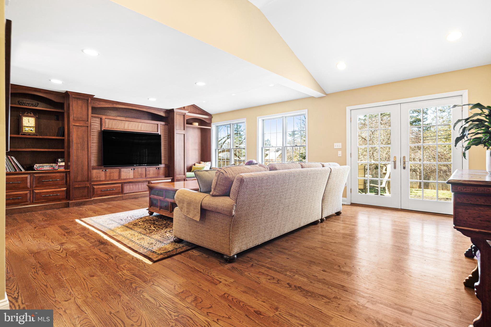3 Briar Road Wayne, PA 19087 - Photo 6 of 48 a living room with furniture flat screen tv and a large window