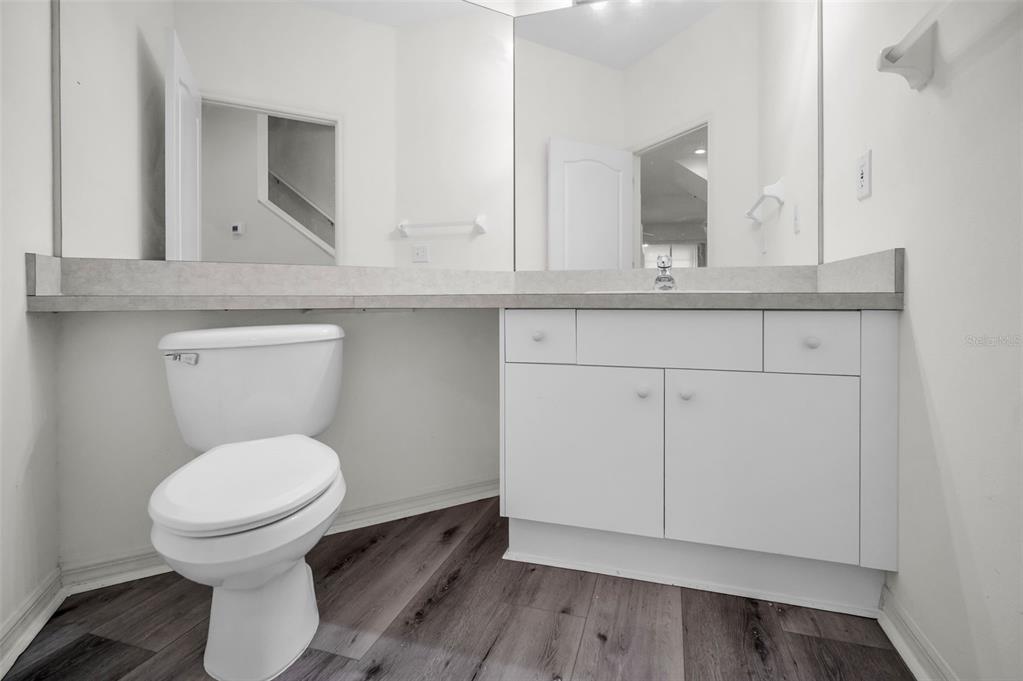 271 Hemingway Drive Oldsmar, FL 34677 - Photo 12 of 31 a bathroom with a toilet a sink and mirror