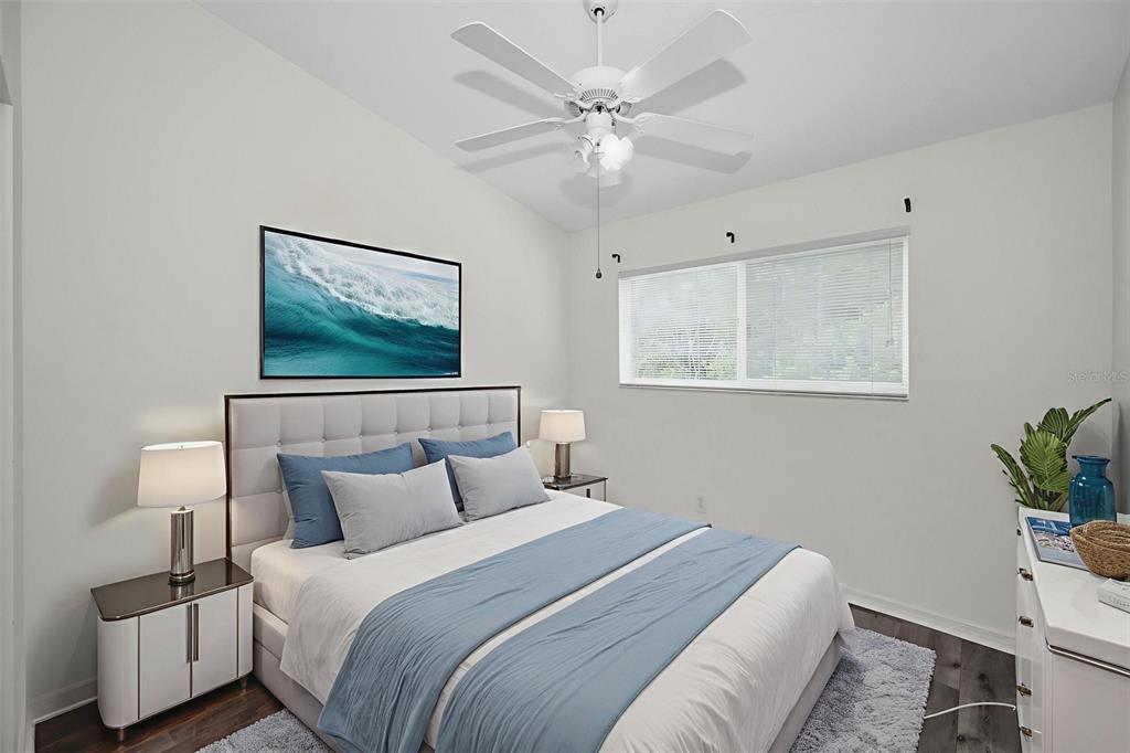 271 Hemingway Drive Oldsmar, FL 34677 - Photo 17 of 31 a bedroom with a bed and a potted plant