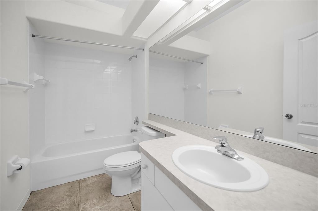 271 Hemingway Drive Oldsmar, FL 34677 - Photo 19 of 31 a bathroom with a toilet a sink and a bathtub