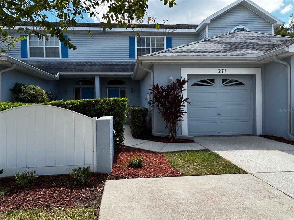 271 Hemingway Drive Oldsmar, FL 34677 - Photo 2 of 31 a front view of a house with garden