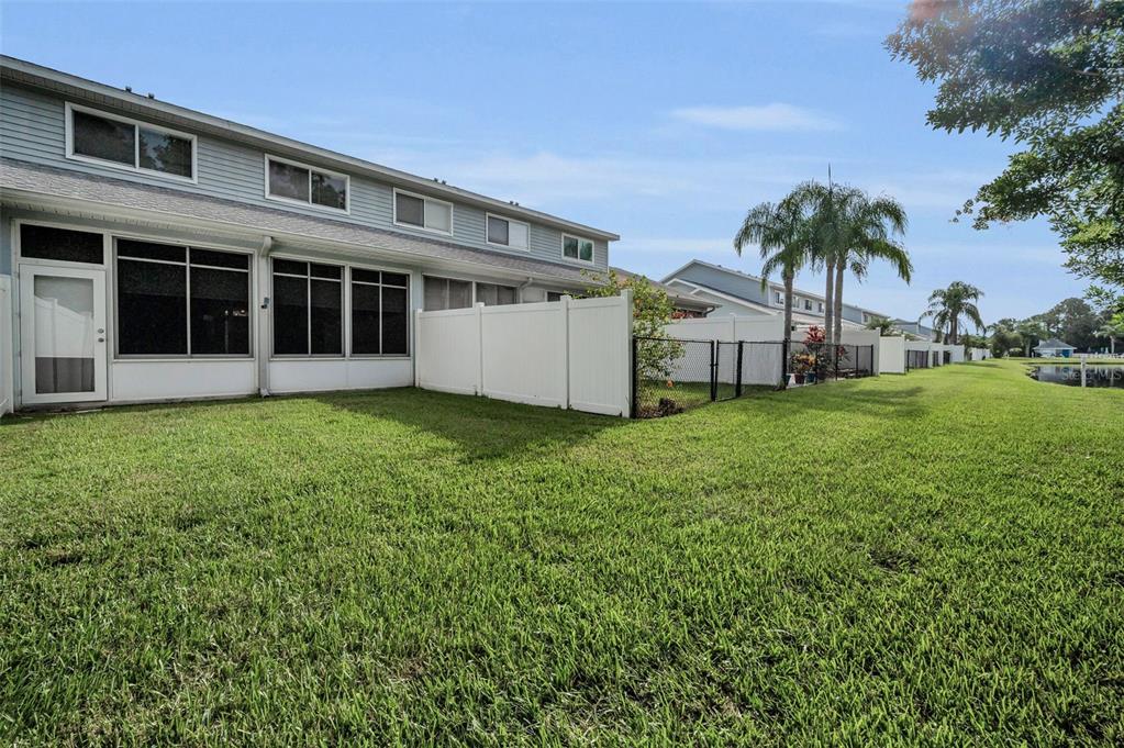 271 Hemingway Drive Oldsmar, FL 34677 - Photo 26 of 31 a view of a house with a yard and a porch