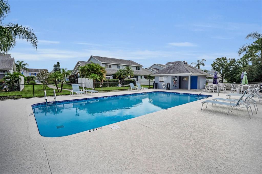 271 Hemingway Drive Oldsmar, FL 34677 - Photo 30 of 31 a view of a lake with a house