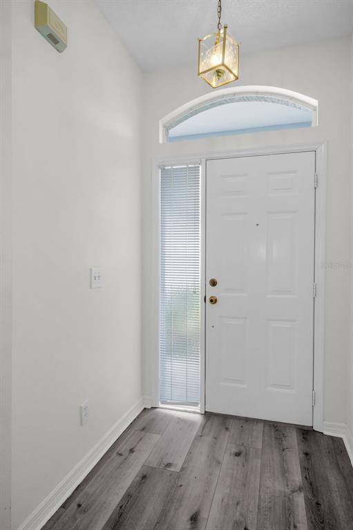 271 Hemingway Drive Oldsmar, FL 34677 - Photo 5 of 31 a view of a room with wooden floor