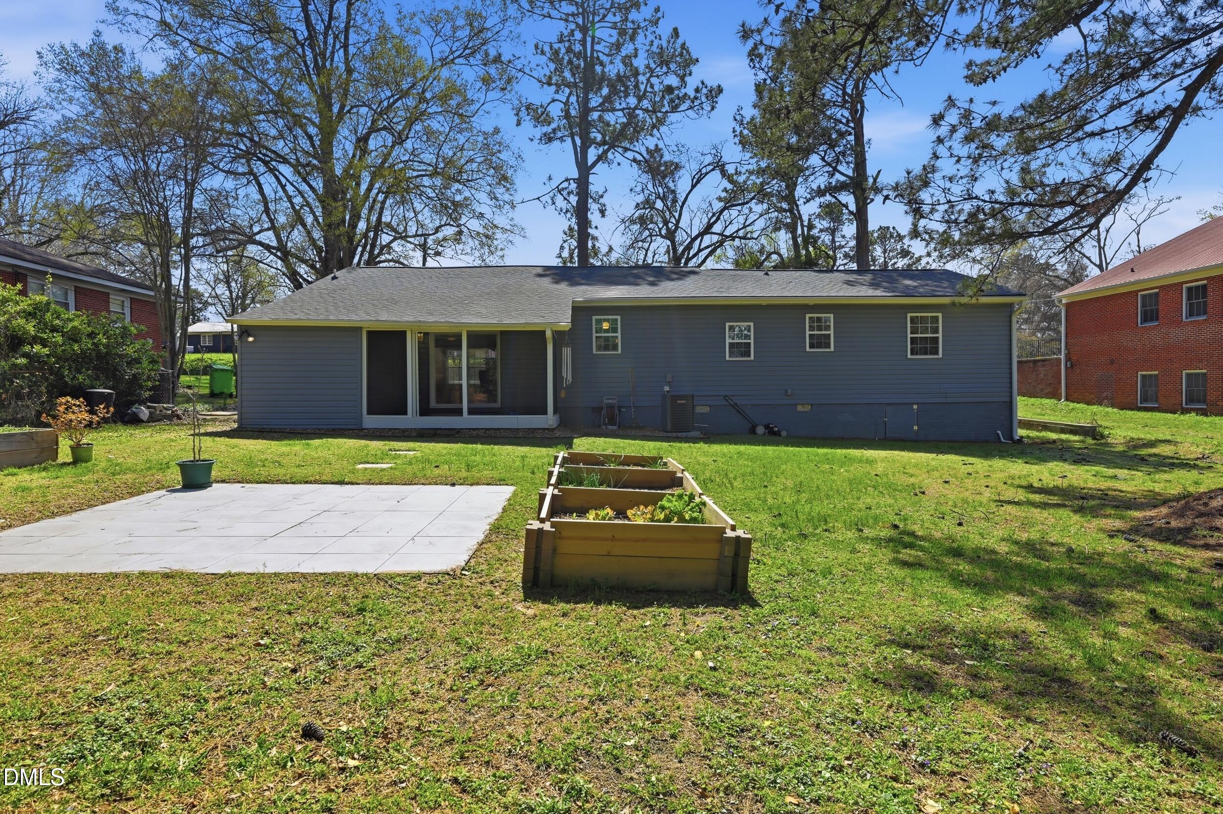 2301 Milburnie Road Raleigh, NC 27610 - Photo 21 of 23 a house view with a garden space