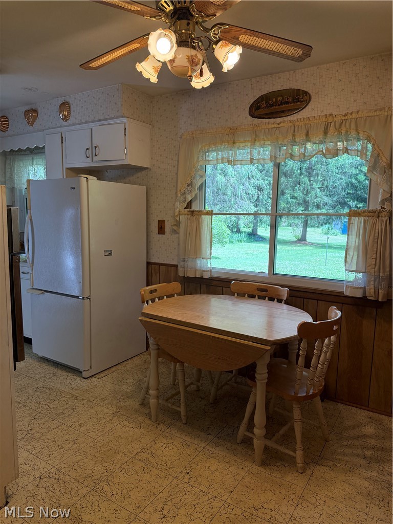 10993 Claridon Troy Road Chardon, OH 44024 - Photo 5 of 20 Kitchen area featuring a ceiling fan with integrated lighting, a double-hung window, and built-in white cabinetry