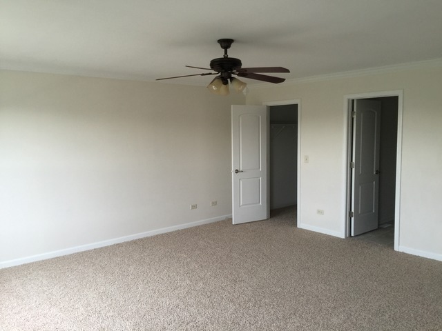 326 Prairie Ridge Drive Minooka, IL 60447 - Photo 11 of 16 an empty room with a ceiling fan