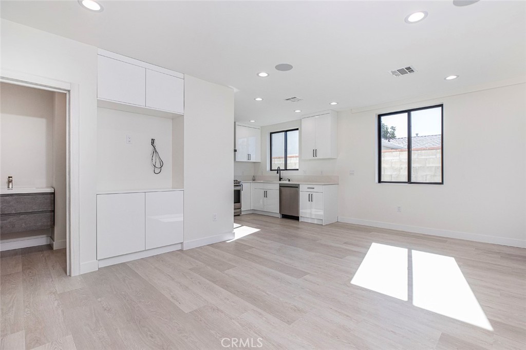 7446 Mammoth Avenue Van Nuys, CA 91405 - Photo 11 of 30 a view of kitchen with wooden floor and window
