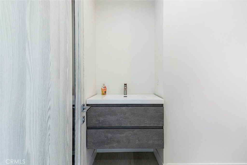 7446 Mammoth Avenue Van Nuys, CA 91405 - Photo 14 of 30 a bathroom with a sink and a mirror