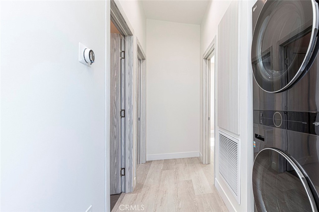 7446 Mammoth Avenue Van Nuys, CA 91405 - Photo 21 of 30 a view of a storage and utility room with washer and dryer