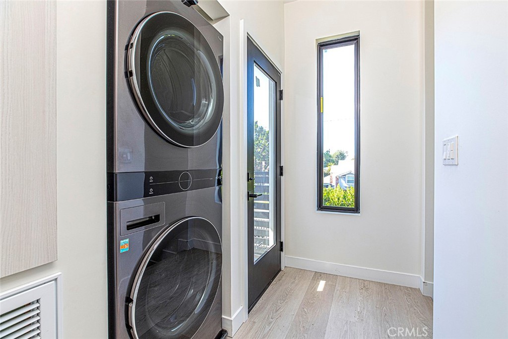 7446 Mammoth Avenue Van Nuys, CA 91405 - Photo 30 of 30 a view of a washer and dryer in a utility room