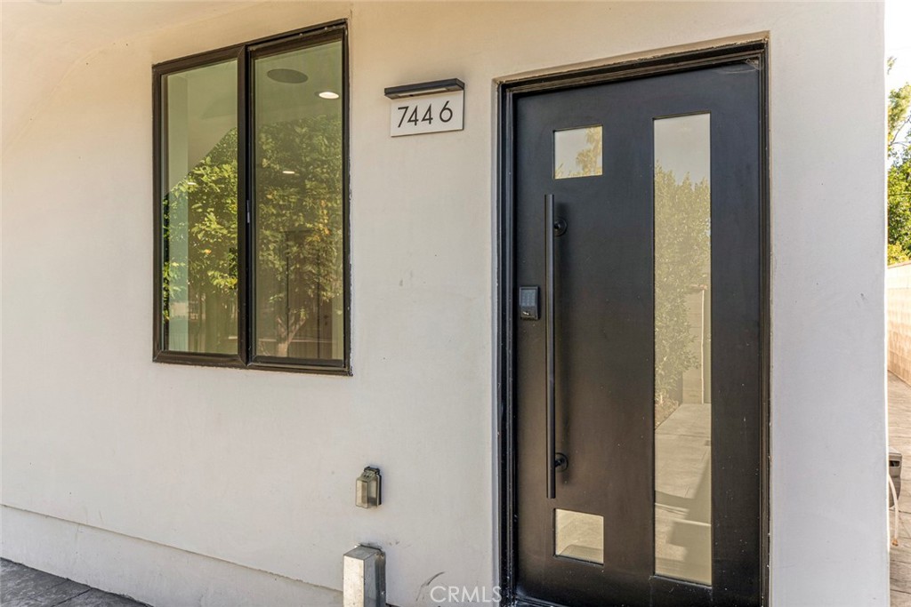 7446 Mammoth Avenue Van Nuys, CA 91405 - Photo 4 of 30 a view of a bathroom with a glass door