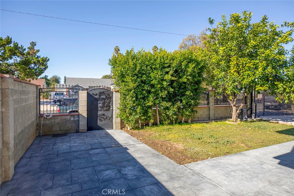 7446 Mammoth Avenue Van Nuys, CA 91405 - Photo 5 of 30 a view of a backyard with a tree