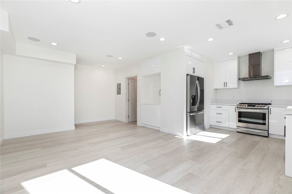 7446 Mammoth Avenue Van Nuys, CA 91405 - Photo 6 of 30 a view of kitchen with stainless steel appliances refrigerator oven and stove