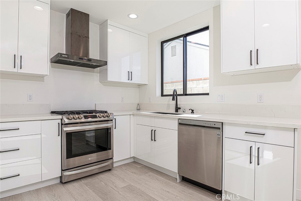 7446 Mammoth Avenue Van Nuys, CA 91405 - Photo 8 of 30 a kitchen with a stove oven and sink