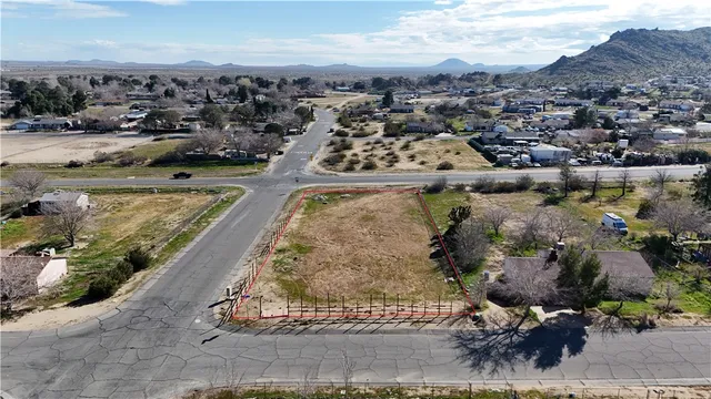 an aerial view of a residential houses with outdoor space