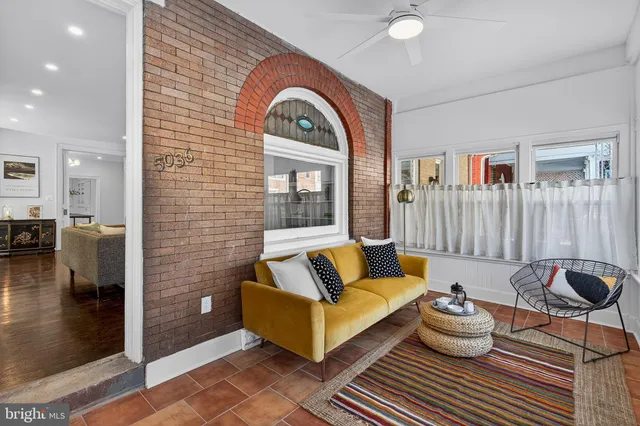 a living room with furniture and a rug