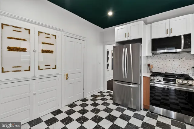 a room with a black white checkered floor with a black white checkered floor