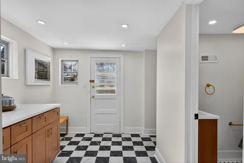 a kitchen with stainless steel appliances a stove a sink and a refrigerator