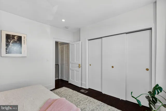 an empty room with wooden floor