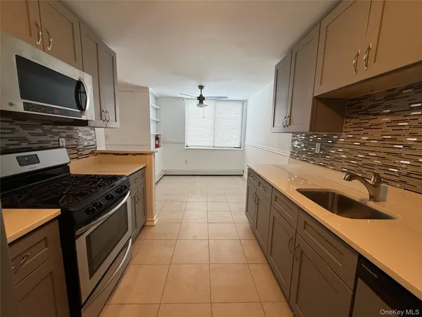 a kitchen with a stove and a microwave