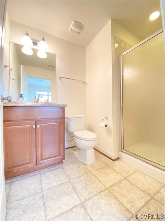 3907 Redbud Road Glen Allen, VA 23060 - Photo 12 of 23 a bathroom with a sink a toilet and a mirror