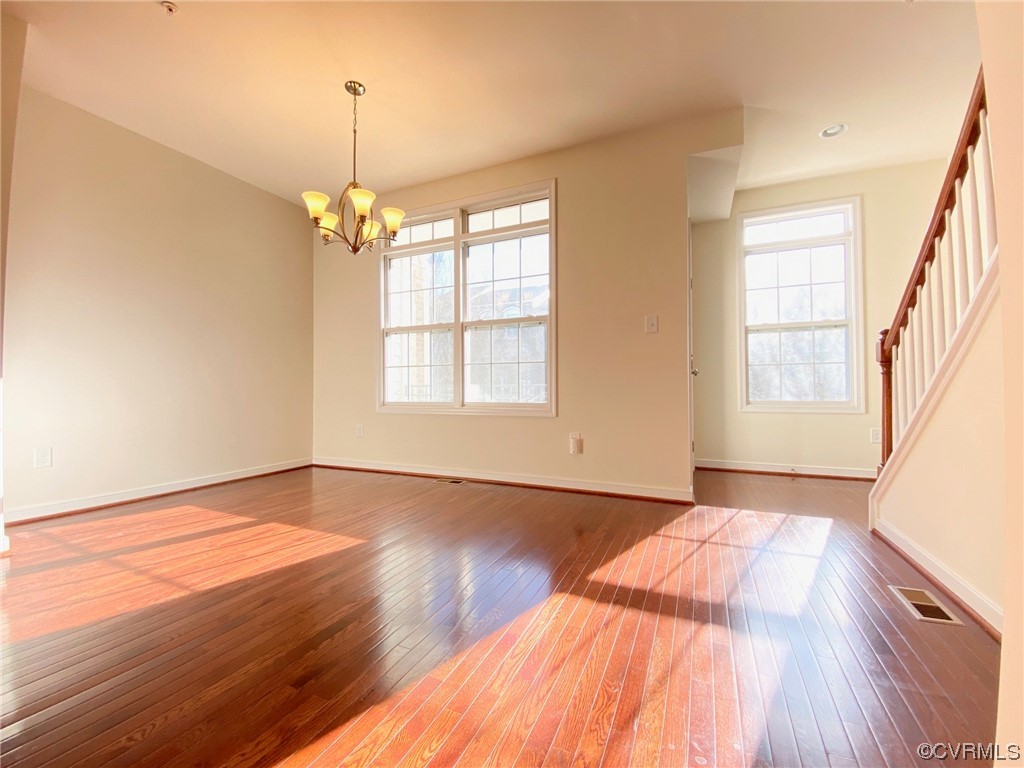 3907 Redbud Road Glen Allen, VA 23060 - Photo 7 of 23 a view of an empty room with wooden floor and a window
