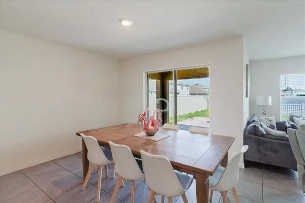 a kitchen with stainless steel appliances kitchen island granite countertop a refrigerator and a sink