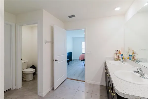 a view of a workspace with furniture and a flat screen tv