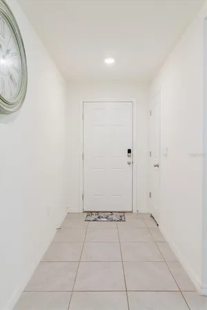 a large kitchen with stainless steel appliances a stove a sink a refrigerator and a microwave