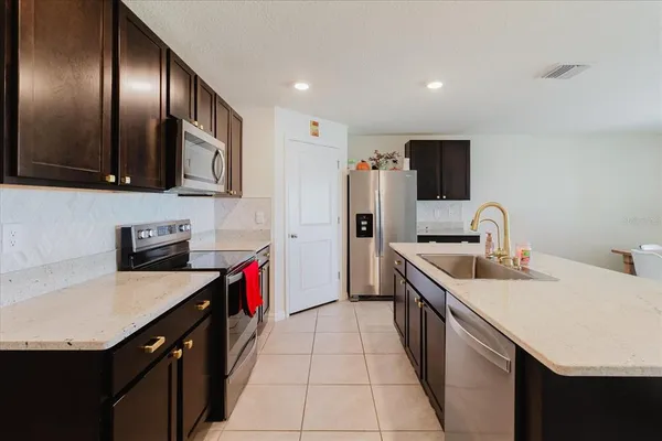 a kitchen with a sink and cabinets
