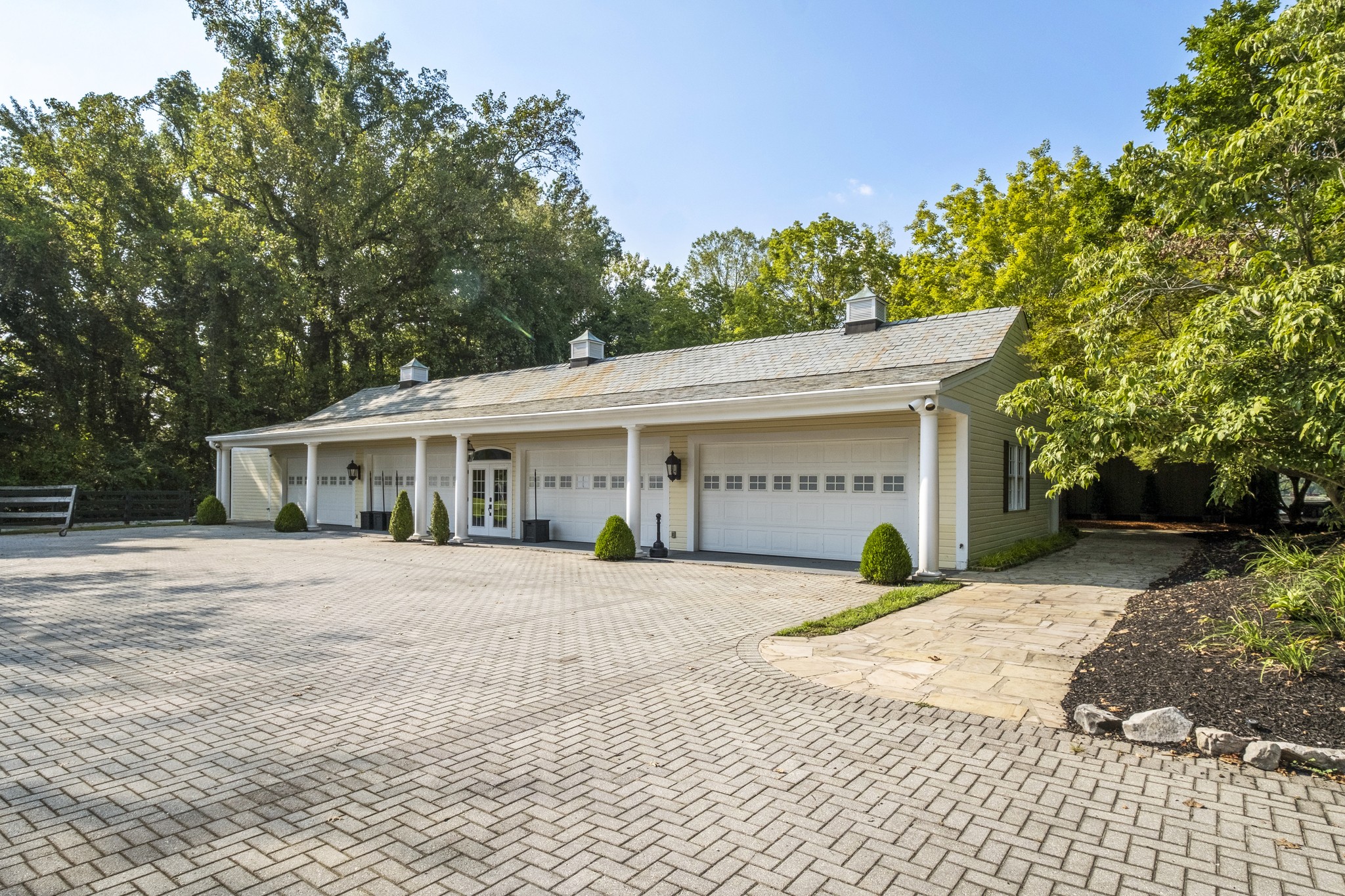 175 Cherokee Dock Road Lebanon, TN 37087 - Photo 32 of 45 a front view of a house with a yard and garage