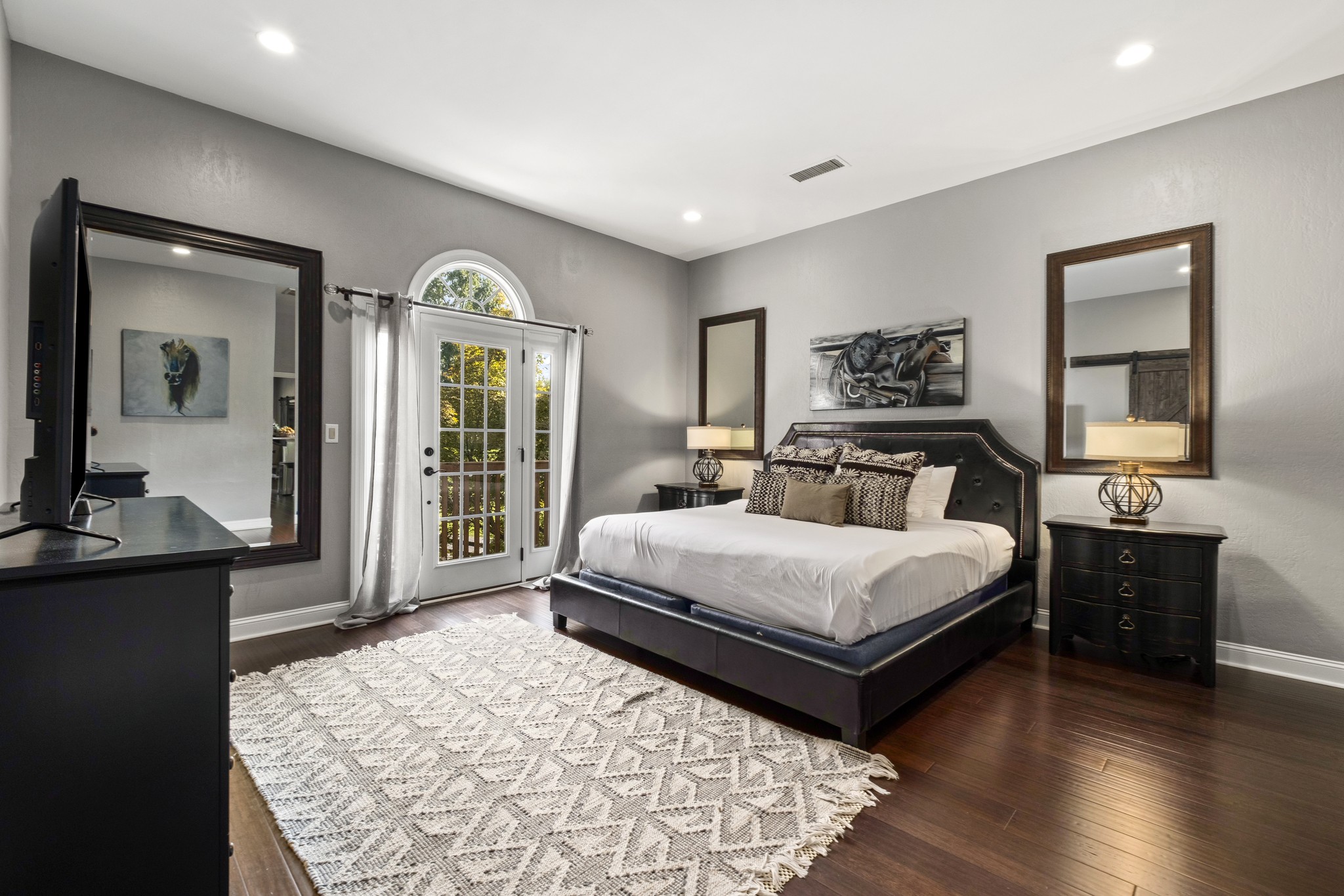 175 Cherokee Dock Road Lebanon, TN 37087 - Photo 38 of 45 a bedroom with a bed and wooden floor