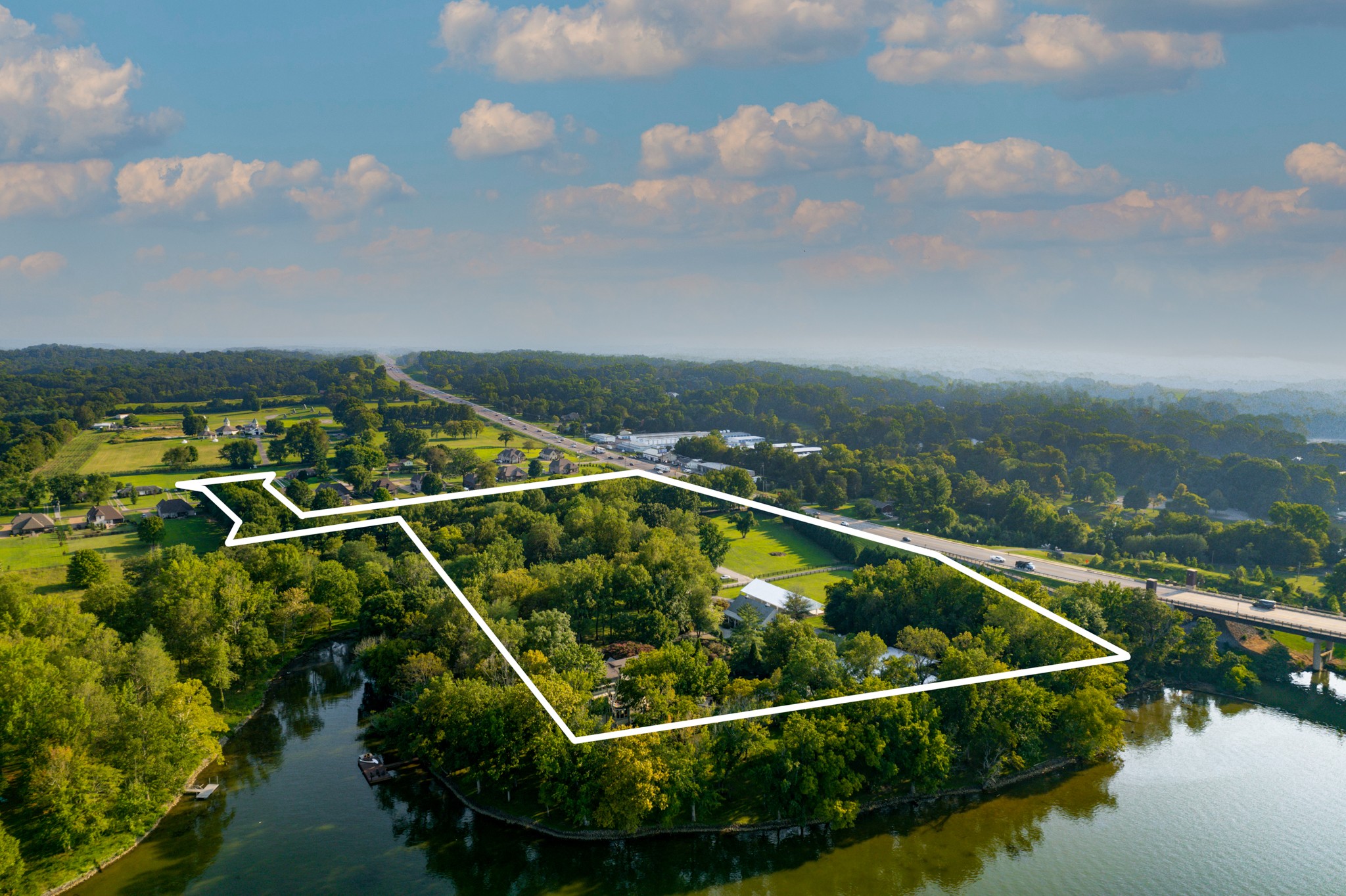 175 Cherokee Dock Road Lebanon, TN 37087 - Photo 45 of 45 a view of a swimming pool and lake from nearby