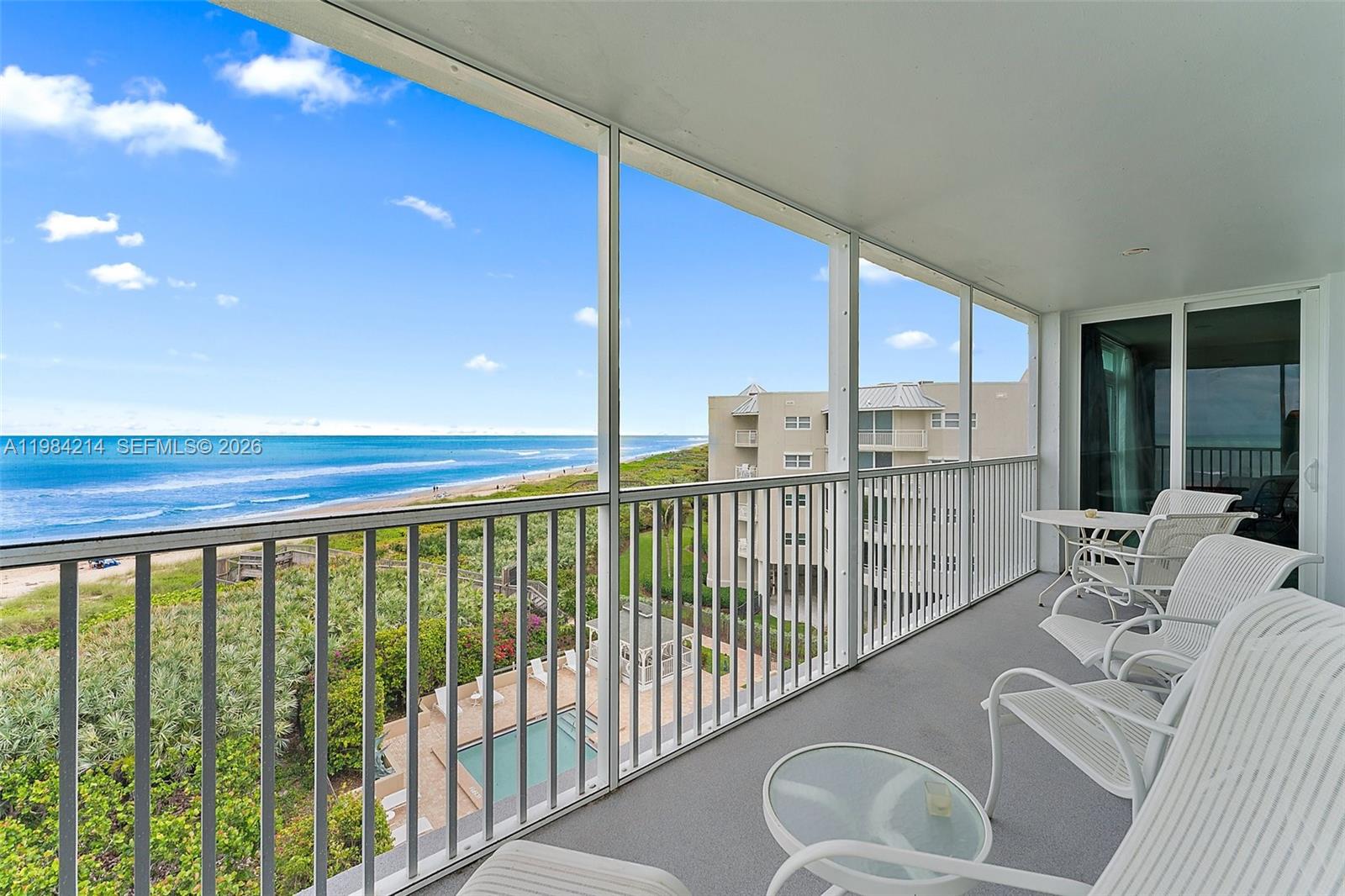 669 Northeast Plantation Road, Unit 406 Stuart, FL 34996 - Photo 3 of 41 a balcony with furniture